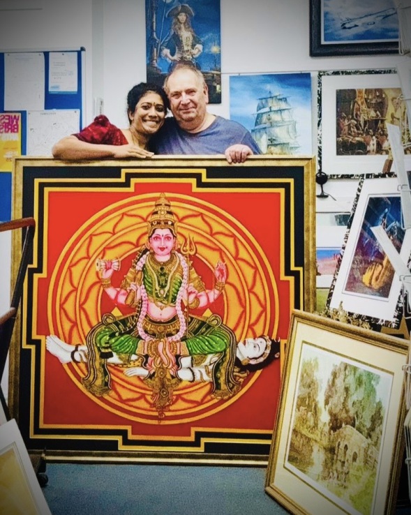 Imaginations fine arts. Customer with oil painting mounted and framed